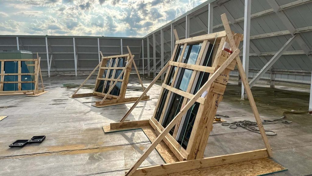 An image of three crates of glass.