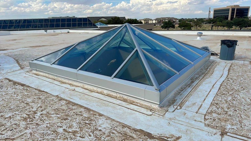 An image of a completed retrofit on the roof with another in the far distance.