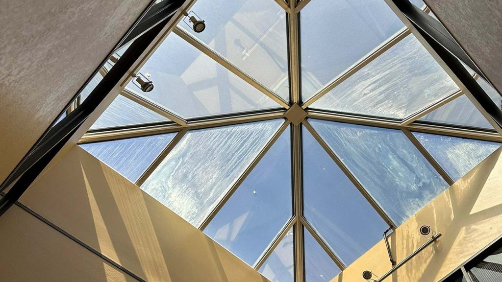 An image of an existing skylight from the interior showing seal failure.