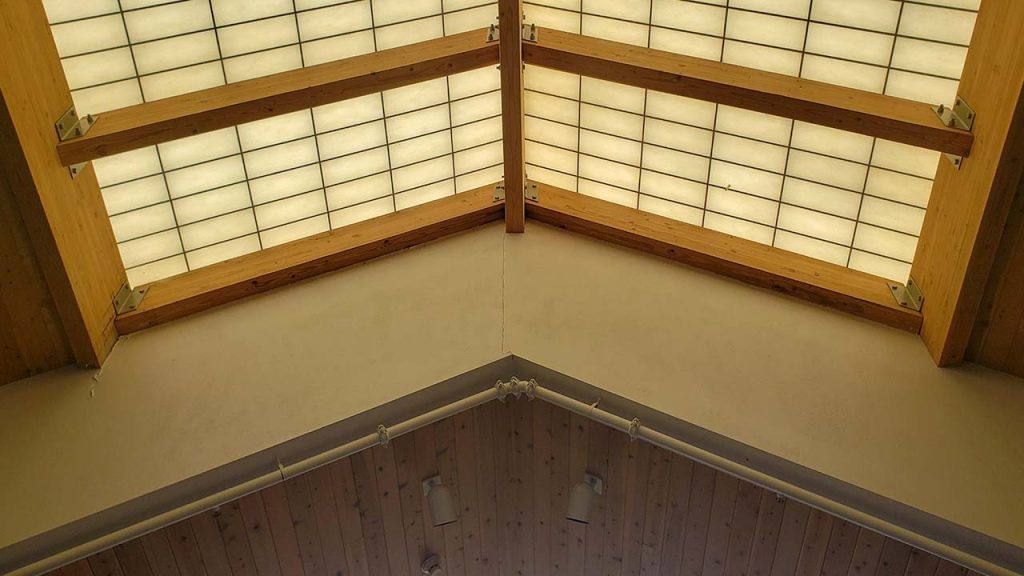 A view of the yellowed skylight overhead.