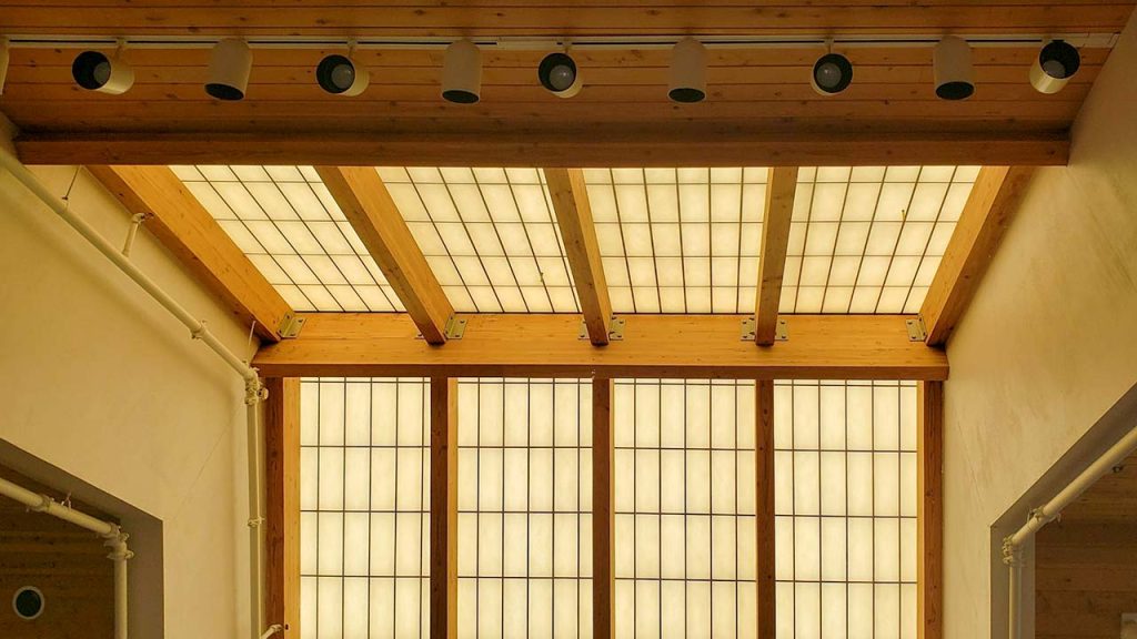 A view of the yellowed skylight overhead.