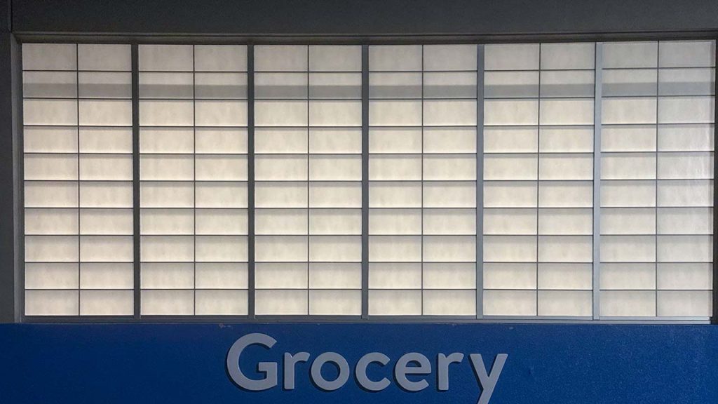 An image of the wall panels above the Walmart Grocery entrance.