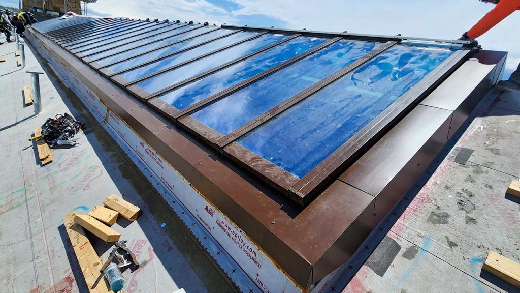 One side of the ridge skylight has been flashed.