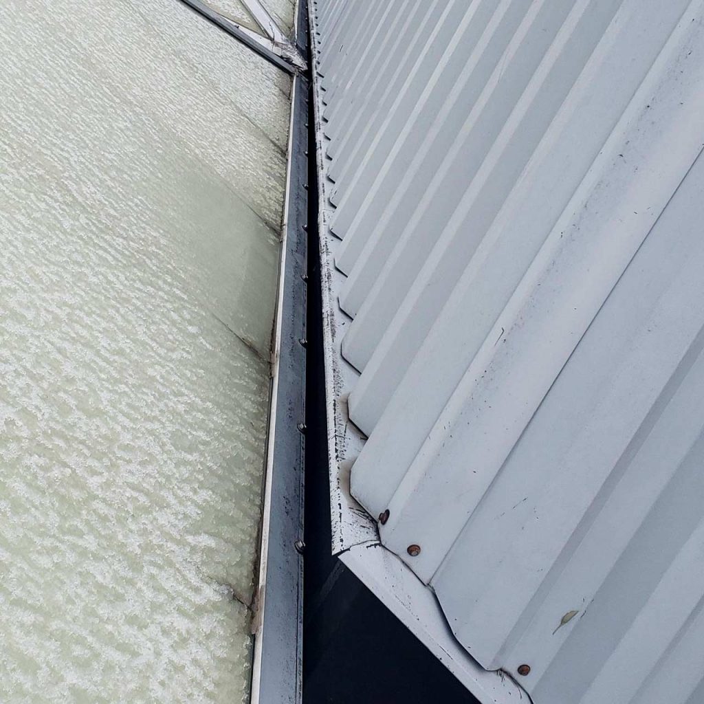 A pyramid skylight showing the narrow gap next to a wall.