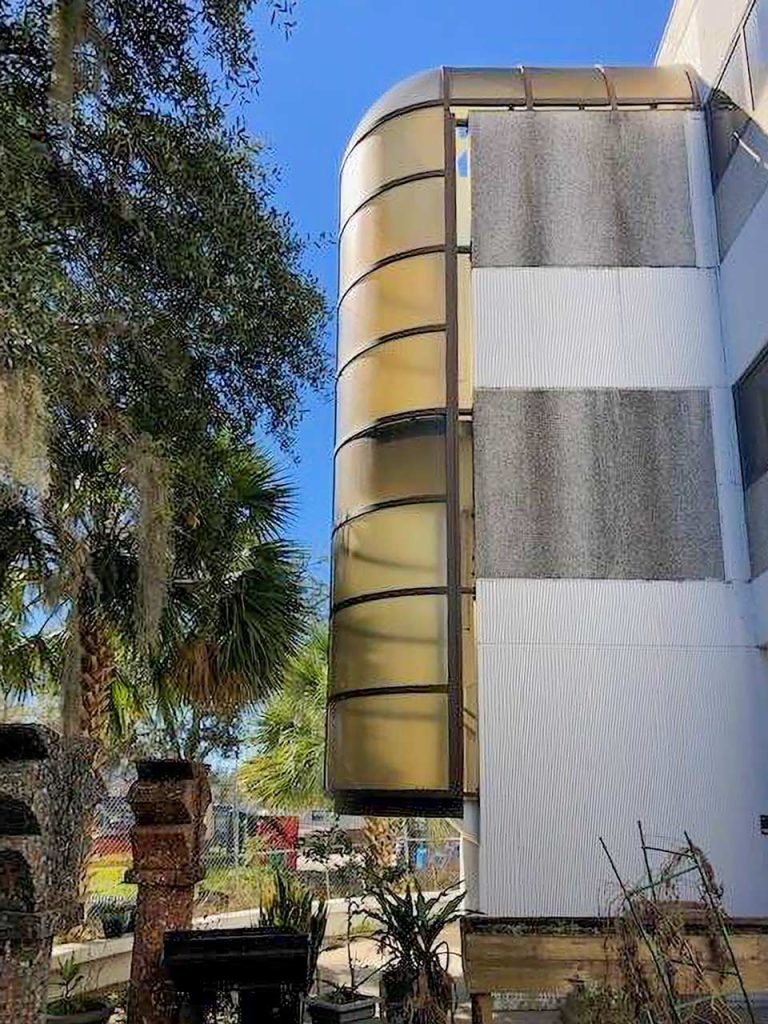 Yellowed stairwell enclosure.