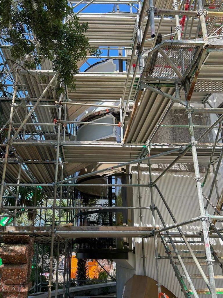 Scaffolding surrounds the stairwell.