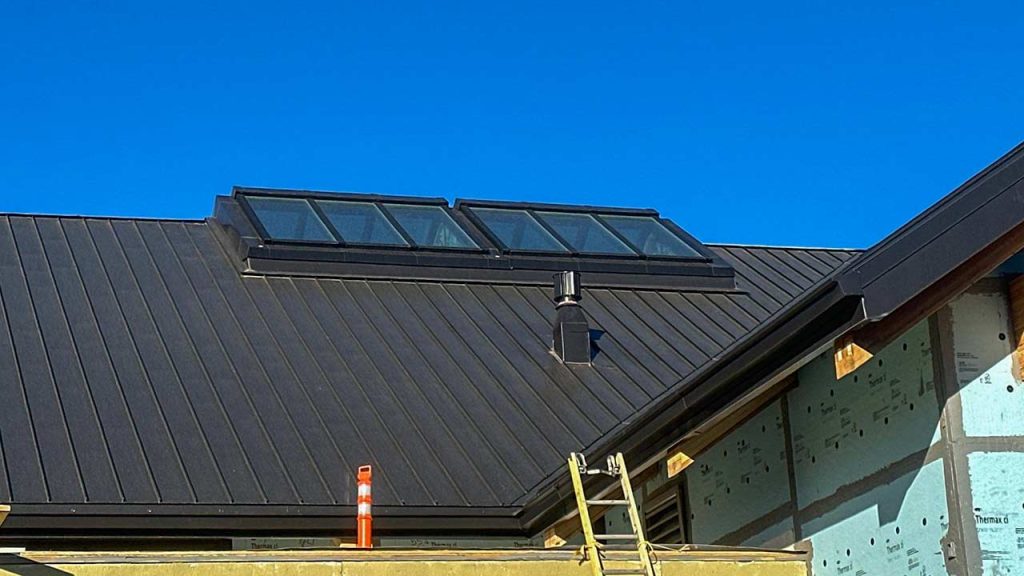 Roof featuring Velux Modular ridge skylights, allowing natural light into the space below.