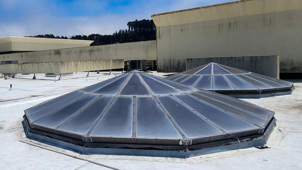 Two weathered skylights on the roof