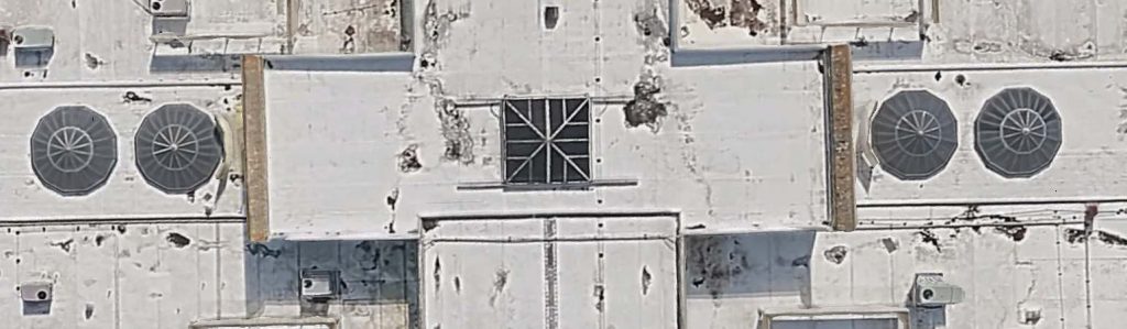 Aerial view of a building showcasing skylights as seen on Google Maps.
