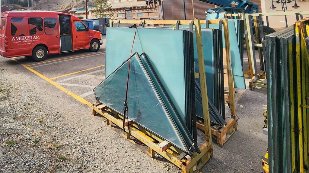Racks of the original glass units in the casinao parking lot awaiting proper disposal.