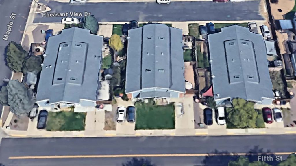 Google maps image of three buildings roofs with a skylight.