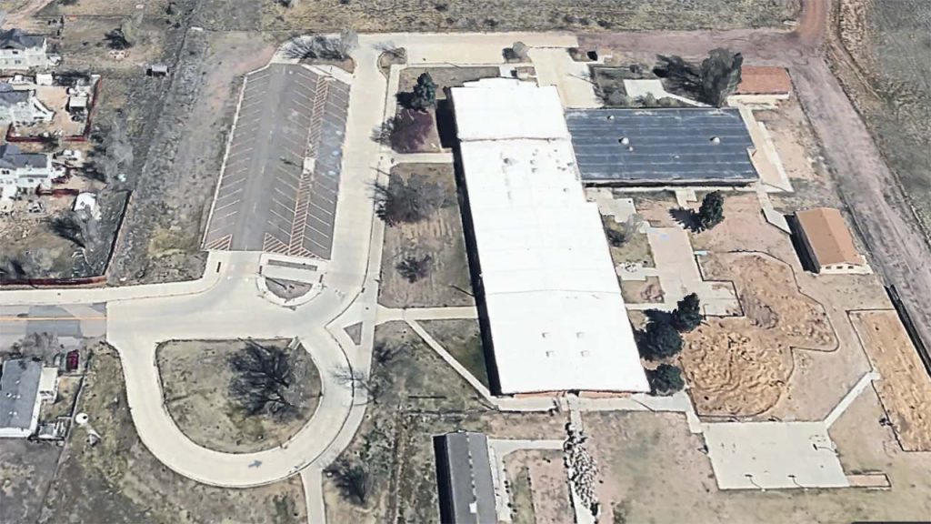 Aerial satellite view of ARP Elementary School showing the white membrane roof section prior to the VELUX tubular skylight installation.