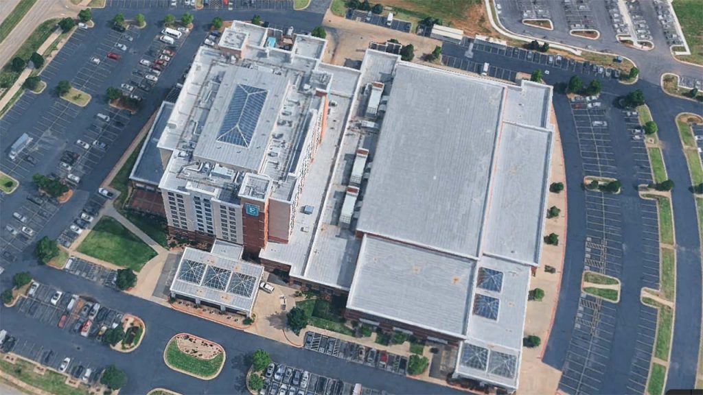 Aerial view of the Embassy Suites hotel rooftop and skylight structure in Norman, Oklahoma.
