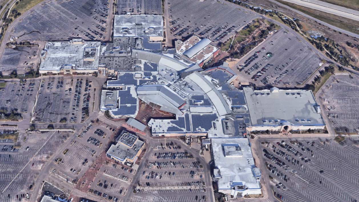 Aerial view of FlatIron Crossing Mall in Broomfield, Colorado, showing the roof layout and surrounding parking lots.